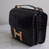 Bolsa Hermès Constance 24 Shiny Alligator Noir com Ferragens Gold