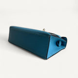 Bolsa Hermès Kelly Pochette Zanzibar com Ferragens Palladium