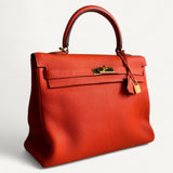 Bolsa Hermès Kelly 35 Togo Orange com Ferragens Gold