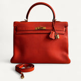 Bolsa Hermès Kelly 35 Togo Orange com Ferragens Gold