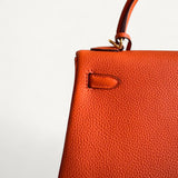 Bolsa Hermès Kelly 25 Togo Orange H com Ferragens Gold