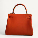 Bolsa Hermès Kelly 25 Togo Orange H com Ferragens Gold
