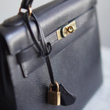 Bolsa Hermès Kelly 32 Taurillon Noir com Ferragens Gold