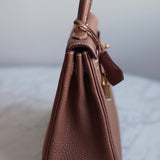 Bolsa Hermès Kelly 25 Togo Gold com Ferragens Gold