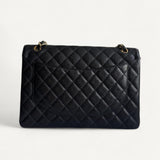 Bolsa Chanel Double Flap Maxi Preta com Ferragens Douradas