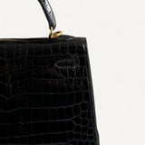 Bolsa Hermès Kelly 25 Crocodile Niloticus Shiny Noir com Ferragens Gold