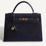 Bolsa Hermès Kelly 32 Taurillon Noir com Ferragens Gold