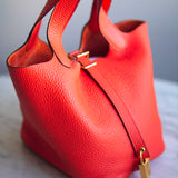Bolsa Hermès Picotin 18 Clemence Orange com Ferragens Gold