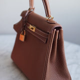 Bolsa Hermès Kelly 25 Togo Gold com Ferragens Gold