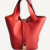 Bolsa Hermès Picotin 18 Clemence Orange com Ferragens Gold