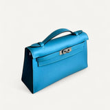 Bolsa Hermès Kelly Pochette Zanzibar com Ferragens Palladium