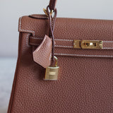 Bolsa Hermès Kelly 25 Togo Gold com Ferragens Gold