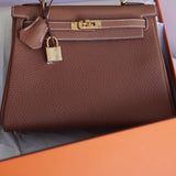 Bolsa Hermès Kelly 25 Togo Gold com Ferragens Gold