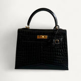 Bolsa Hermès Kelly 25 Crocodile Niloticus Shiny Noir com Ferragens Gold