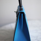 Bolsa Hermès Kelly 25 Epsom Bleu Zanzibar | Bleu Nuit com Ferragens Palladium